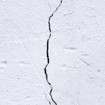 A white wall with a crack - SEO title: (100 characters) Cracks and subsidence in a property, a cause for concern?
